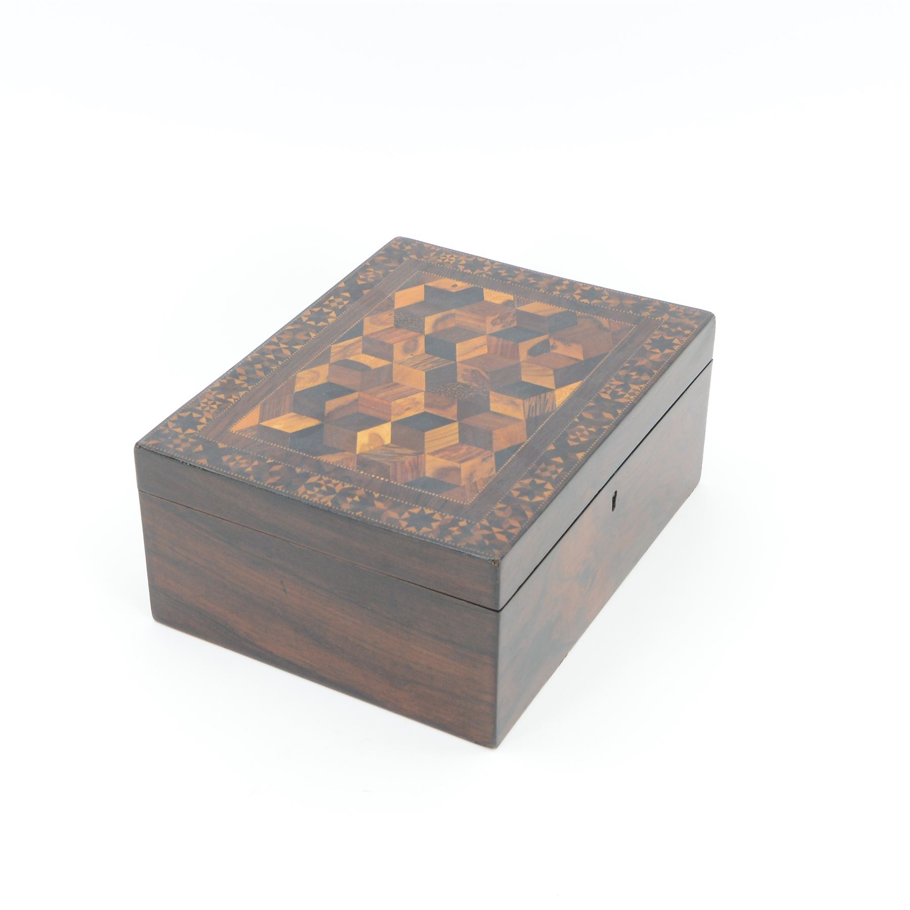 19th century Tunbridge ware marquetry box, the hinged cover decorated with tumbling blocks in specimen timbers and hardwood, within a star border, H10cm W23.5cm D18cm