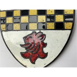 Henry George Murphy (1884-1939), Arts & Crafts enamel panel, of shield form, decorated with three red lions on a white ground, with a yellow and black banner to the centre, H9cm W7.5cm
