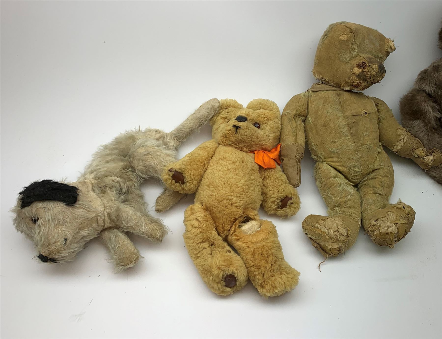 Quantity of early wood wool filled teddy bears for restoration.