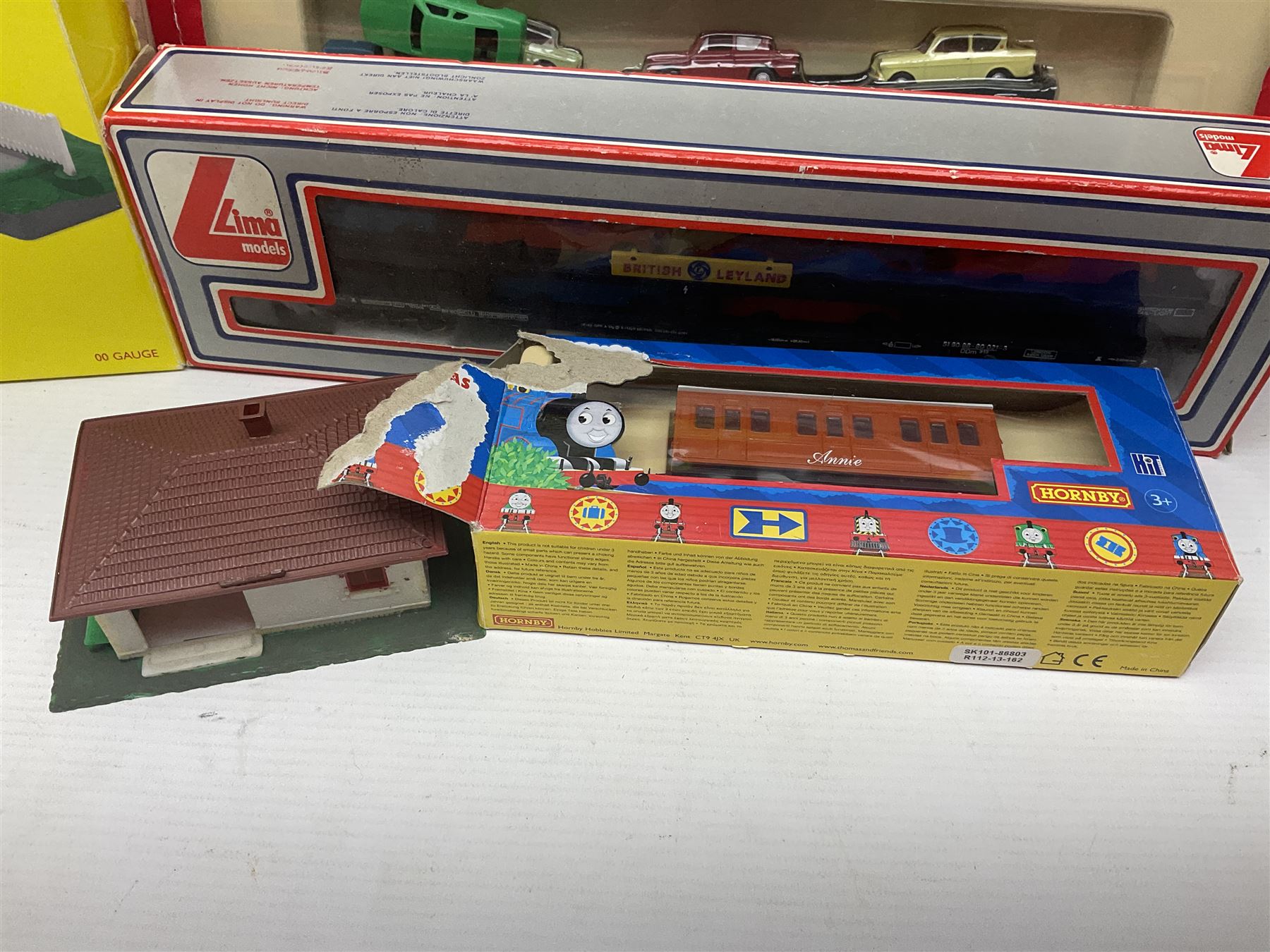 Hornby '00' gauge - Thomas the Tank Engine and Friends 0-6-0 tank locomotive No.1 with Annie and Clarabel coaches; all boxed; Breakdown Pack, Car Transporter Pack, Fuel Tanker Pack and Automatic Level Crossing; all boxed; Lima Car Transporter; boxed; and quantity of trackside accessories etc
