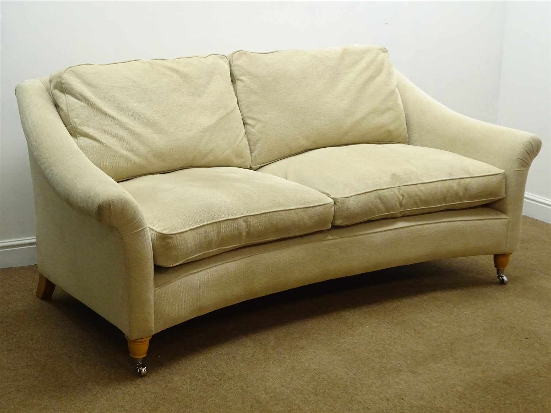 Laura Ashley two seat curved sofa upholstered in Eloise natural