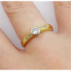 18ct gold single stone bezel set round brilliant cut diamond ring, with diamond set shoulders, total diamond weight 0.25 carat, hallmarked