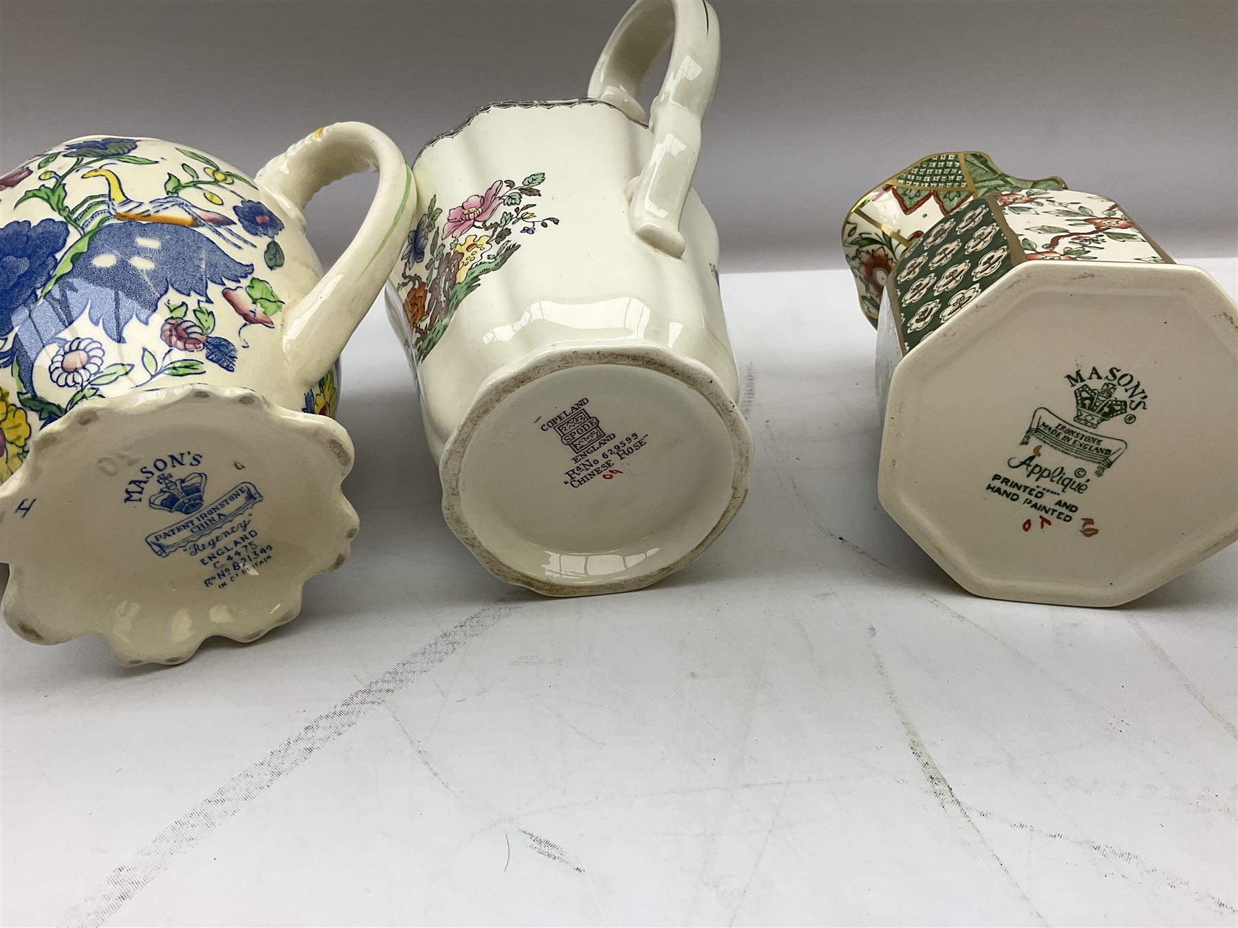 Group of ceramics to include Art Deco examples, Arthur Wood twin handled vase decorated in the Garden Wall pattern, Art Deco style Coalport twin handled lidded sucrier and saucer, Mason's Applique jug (scratch through mark), Royal Doulton Minden bowl and jug, Copeland Spode Royal Jasmine jug, Crown Devon, etc