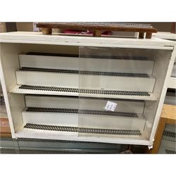 Six shelved cabinets for displaying ‘00’ gauge locomotives comprising plain plywood and white painted examples with track applied to various shelves, largest H63cm, W107cm, D27cm; Collection of tools for building model locomotives to include Weller PU-2D Soldering Pencil and Standard Tip Soldering Iron 20W/230V, Humbrol Modellers Airbrush, Power Supply Units and two wooden chests one of which housing a collection of tools including tweezers, scalping tools, wrenches etc 