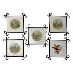 Four Minton tiles decorated with game birds, with another similar example, each within a metal frame H17cm
