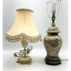 Onyx and gilt metal mounted table lamp, with fabric shade, together with further table lamp of baluster form decorated with a peacock amidst flowers