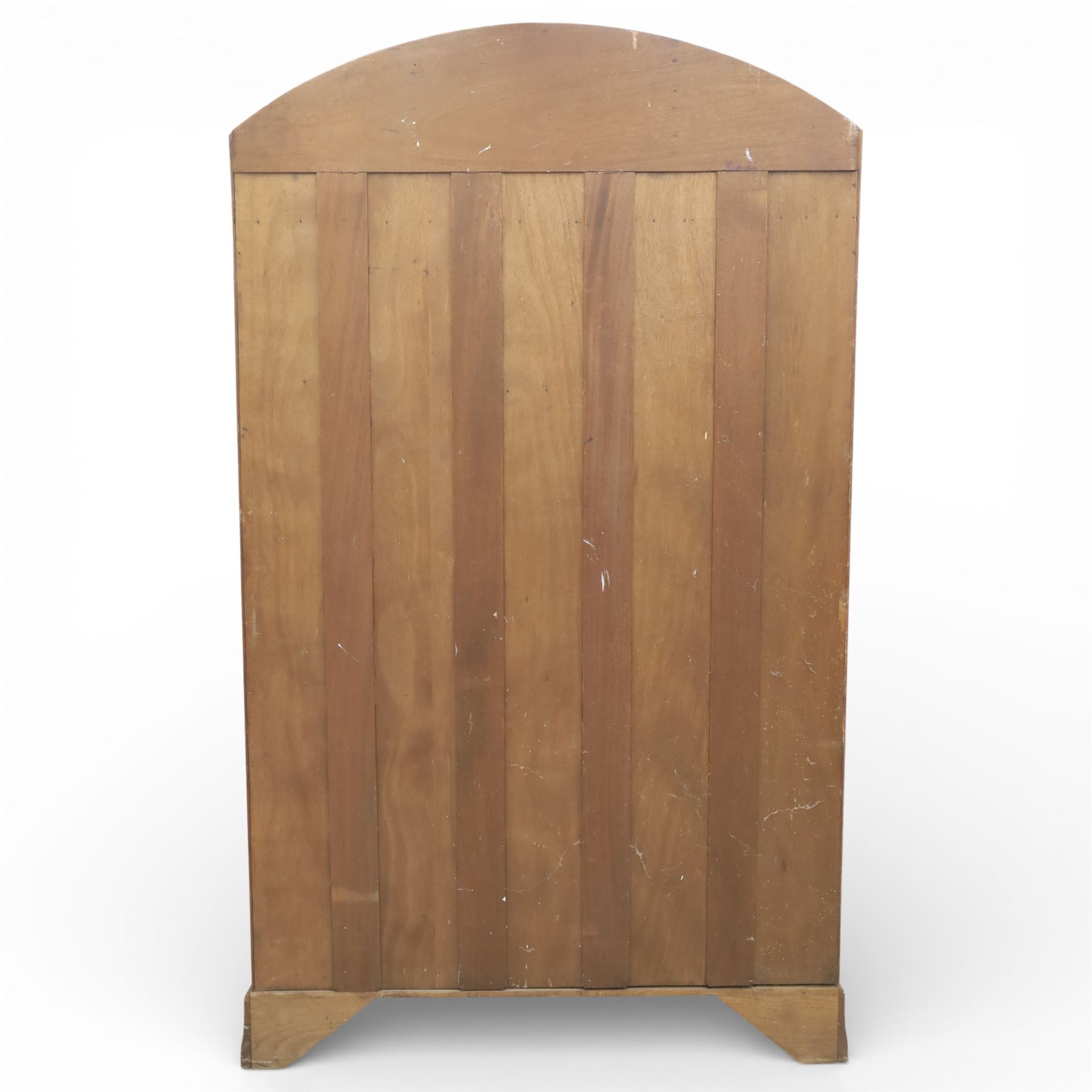 Early 20th century Art Deco bedroom suite, comprising double wardrobe, dressing table and chest of drawers, constructed in walnut with figured veneers and geometric banding, the wardrobe with arched top and panelled doors enclosing a fitted interior, the dressing table with rectangular top below a three panel mirror arrangement, fitted with two short over two long drawers, the chest with three short and three long drawers, each piece fitted with faceted handles and raised on shaped feet
Wardrobe (H 177cm, D 46cm, W 112cm)
Chest (H 85cm, D 48cm, W 92cm)
Dressing table (H 160cm, D 52cm, W 106cm)
