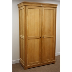  Solid light oak double wardrobe, two panelled doors enclosing fitted interior, W118cm, H200cm, D60cm  