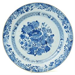 18th century Chinese oval dish shallow dish decorated with flowers in blue and white within a scroll and key pattern border W37cm and a Chinese blue and white charger D34cm (2)