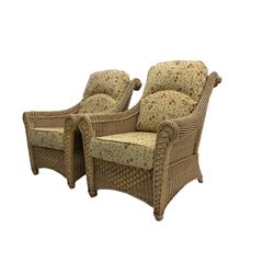 Four piece cane conservatory suite - two seat sofa (W130cm), pair of armchairs (W85cm), and coffee table (85cm x 60cm)