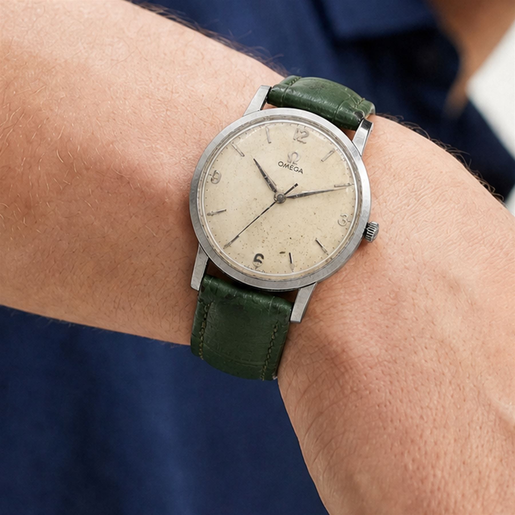 Omega gentleman's stainless steel manual wind wristwatch, silvered dial with baton and Arabic hour markers, on green leather strap