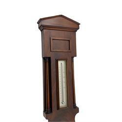 McDowall of Edinburgh - mid-Victorian mahogany mercury wheel barometer, with a gable pediment and cavetto moulded square base, cast brass bezel enclosing a 10-inch silvered register with an engraved symmetrical pattern to the centre and barometric air pressure in inches, boxed mercury thermometer with a silvered Fahrenheit scale flanked by turned wooden pilasters, brass recording hand button, rectangular spirit level signed McDowall, Edinburgh.
This barometer once formed part of the collection of Edwin Banfield, a leading authority on barometers and is illustrated in his book 