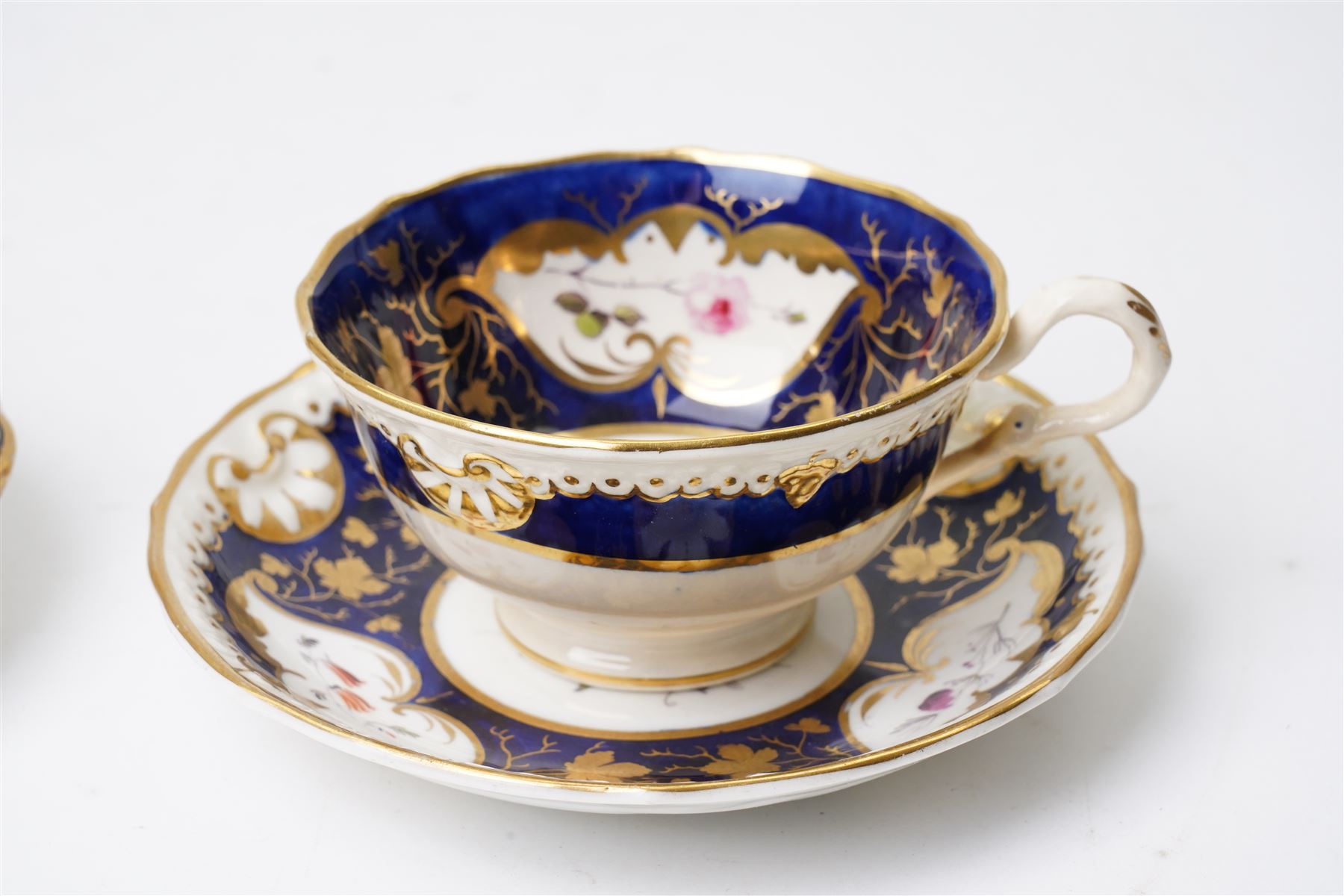 Grainger Lee & Co Worcester teacup, together with a collection of cobalt blue cabinet cups and saucers,  including a Royal Doulton hand-painted example by E Percy, and various others 19th century and later, mostly unmarked (7 pairs)