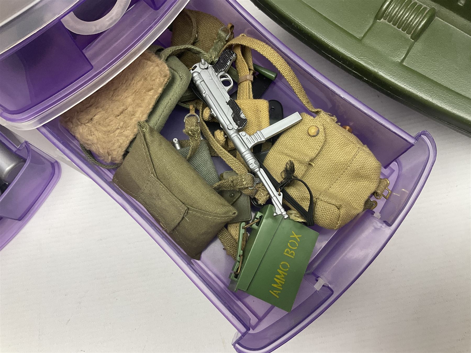 Action Man - five figures marked on the back 'Made in England by Palitoy under licence from Hasbro 1964', one dressed as a German Stormtrooper, one as a Red Devil Pilot and three in army uniform; another similar action figure marked to the right buttock ' G.I. Joe Copyright 1964 by Hasbro Patent Pending Made in Canada' dressed in army uniform; together with an Action Man jeep, field gun, mortar and machine guns and other accessories including helmets and weapons, parachute, diving equipment, skis and snow shoes, boots, uniforms etc; all unboxed