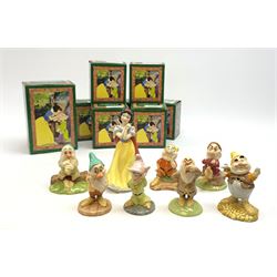 Royal Doulton Snow White and the Seven Dwarfs figurines, each with box. (8). 