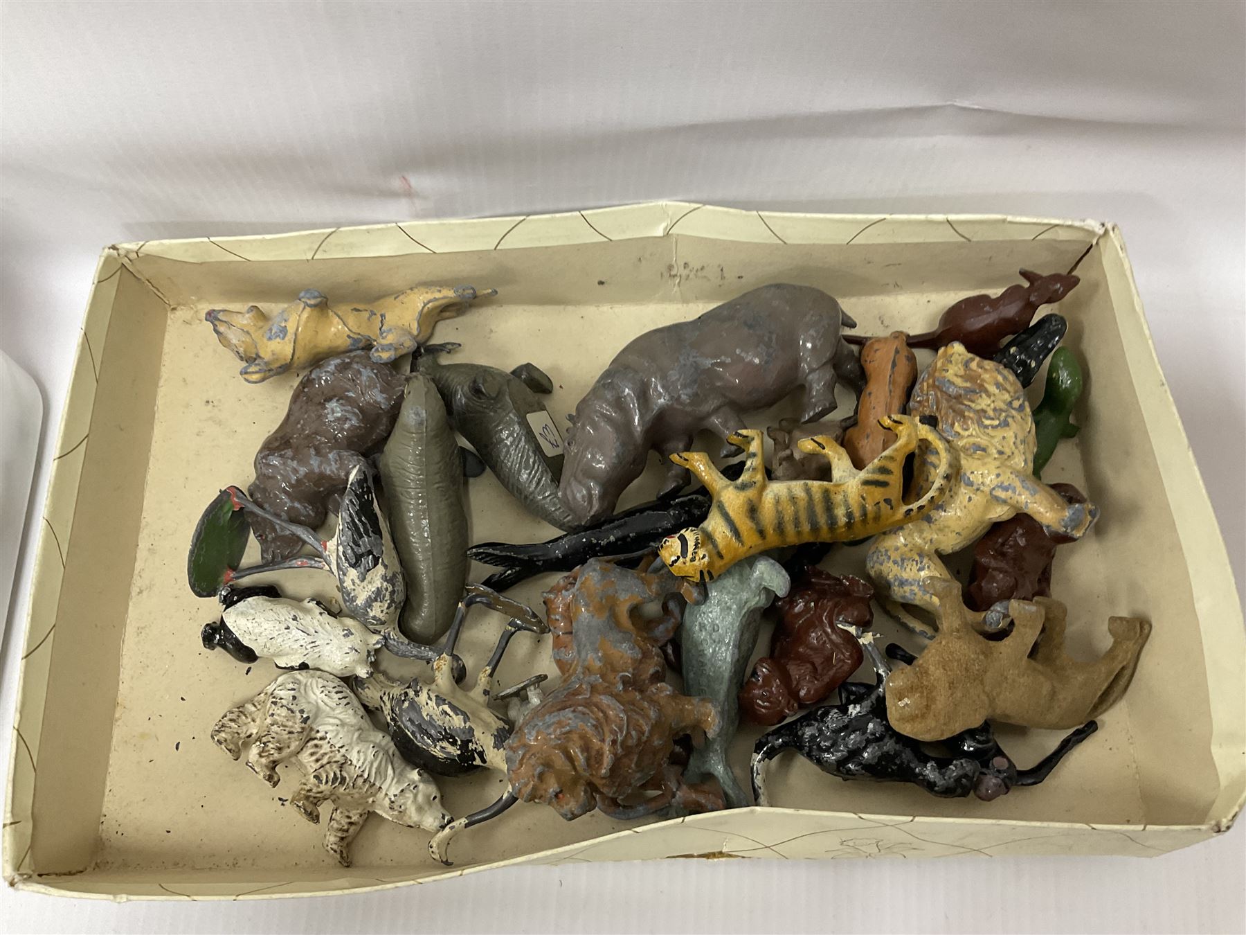 Large quantity of playworn 1950s Britains and other lead figures including farm and zoo animals, horse drawn carts, fencing etc