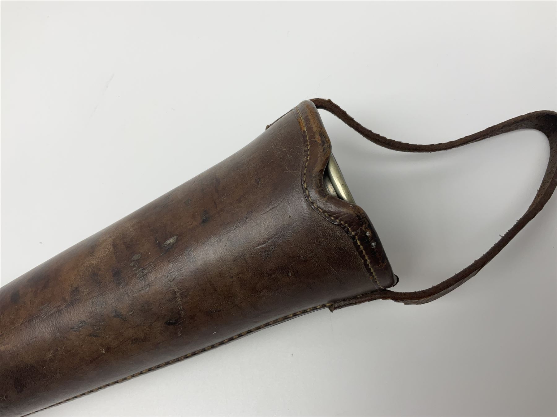 19th century telescopic hunting horn, the bell engraved 'The Beaufort', with makers mark Kohler & Son, makers, 61 Victoria Street, Westminster (from Covent garden) London, in a leather sheath, horn full extended L91cm 