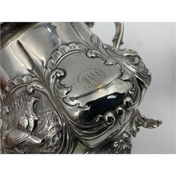 Victorian silver three piece tea service, comprising teapot, twin handled open sucrier, and milk jug, each of bellied form with acanthus capped scroll handles, the sides embossed with alternating scroll edged vacant panels and panels containing a pair of birds, upon four palmette feet, the teapot with ivory insulators to handle, and bird finial to the hinged domed cover, hallmarked William Hunter & Son, London 1861, teapot H19cm, including handles sucrier H13.5cm, including handle milk jug H12cm

This item has been registered for sale under Section 10 of the APHA Ivory Act