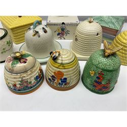 Clarice Cliff for Wilkinson Ltd Crocus Bizarre beehive honeypot painted in the Crocus pattern, together with two beehive Beswick honey pots, Poole square honey pot etc (14)