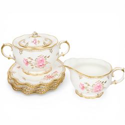 Modern Royal Crown Derby tea set for six place settings, decorated in the Royal Pinxton Roses pattern, comprising tea cups, saucers, small dishes, side plates, dessert plates, one serving plate, twin handled lidded sucrier and milk jug