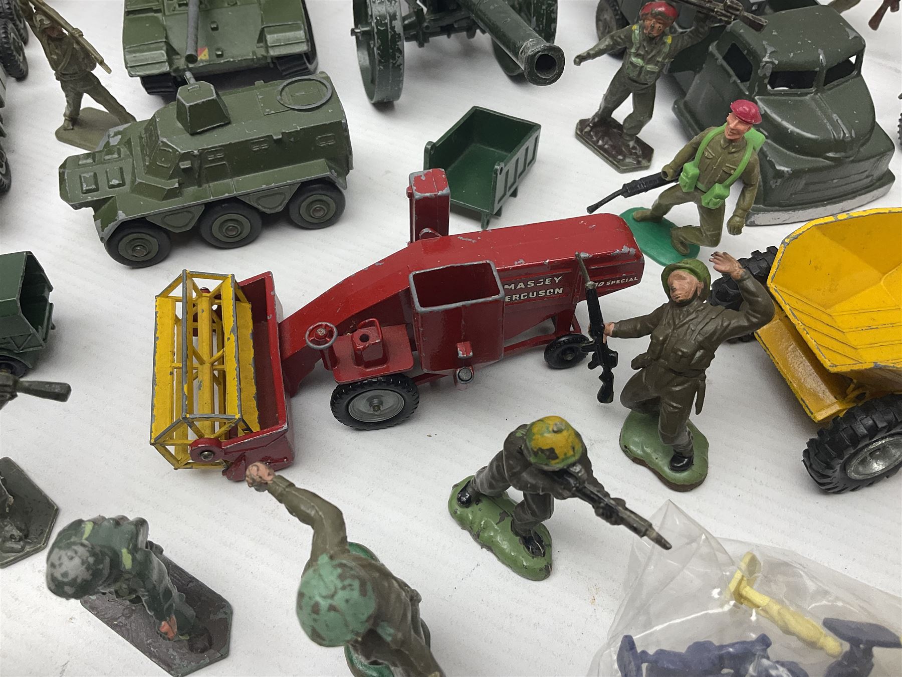 Various makers - unboxed and playworn die-cast models including Dinky Thornycroft Mighty Antar Tank Transporter No.660 and Centurion Tank No.651, other military and farm vehicles; and quantity of loose plastic soldiers and other figures by Crescent, Britains etc