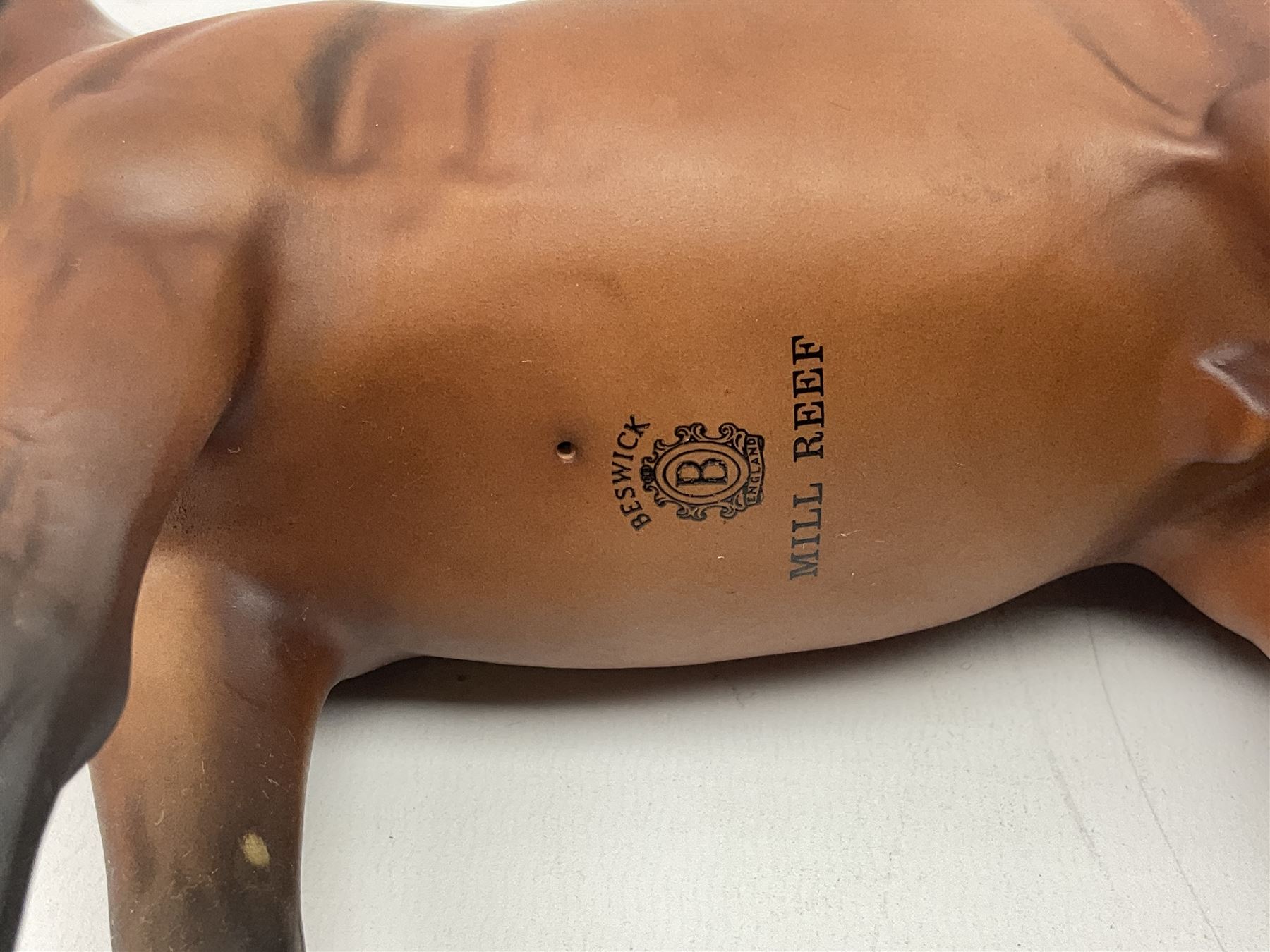 Beswick 'Mill Reef' horse figure, on a wooden plinth together with Beswick Ware horse figure 'Red Rum' on wood plinth, both with printed mark beneath