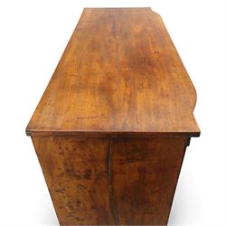 19th century mahogany bow fronted chest, the moulded top over four long cock-beaded drawers with brass swan neck handles and shield shaped bone escutcheons, flanked by reeded uprights, raised upon shaped bracket feet