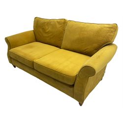 Next Furniture - traditional shaped three-seat sofa, upholstered in mustard velvet, rolled arms with pipping, on turned front feet