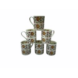 Minton Haddon Hall pattern tea and dinner wares, including basket dish, two covered tureens, six dinner plates, eight dessert plates, twelve tea plates, six soup bowls, six cereal bowls, teapot, coffee pot, milk jug, covered sucrier twelve tea cups and saucers, six mugs, footed bon bon dish, pair of candlestick holders, cake knife and slice etc (81)