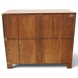 19th century figured mahogany military campaign chest of drawers in two sections, the rectangular top with brass-bound corners over two short and three long graduated drawers, each fitted with recessed brass campaign handles and escutcheons, the carcass with brass strapwork and carrying handles to the sides, raised on short bracket feet