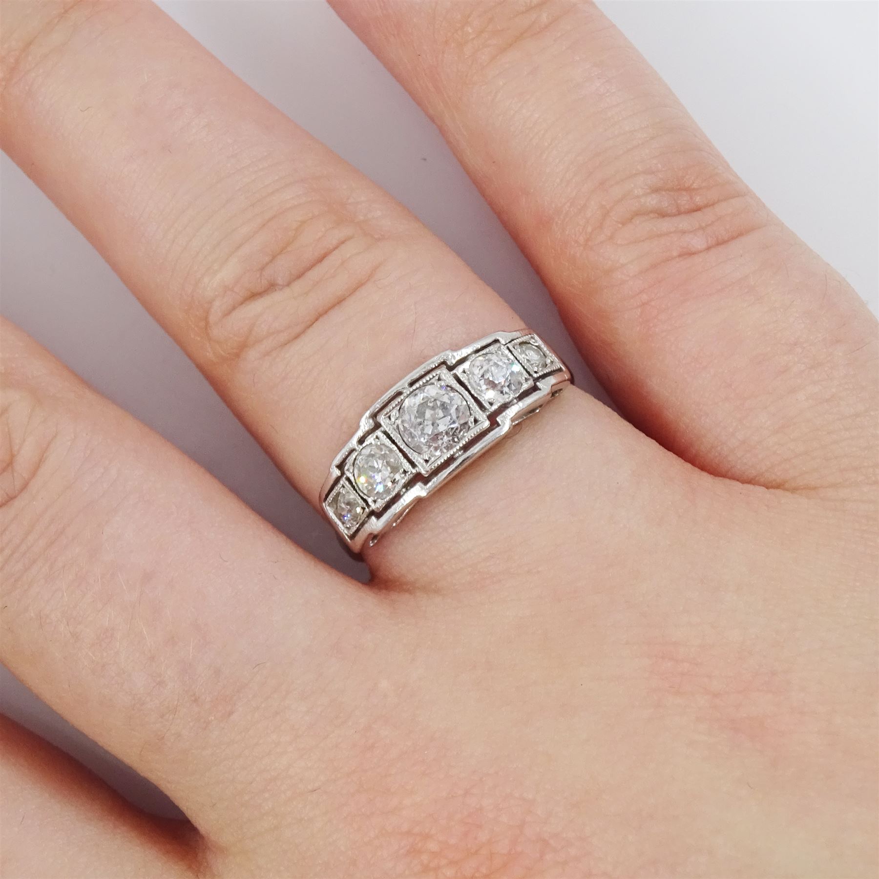 Art Deco white gold diamond ring, five milgrain set graduating old cut diamonds, in a square openwork setting, stamped 18ct, total diamond weight approx 0.80 carat