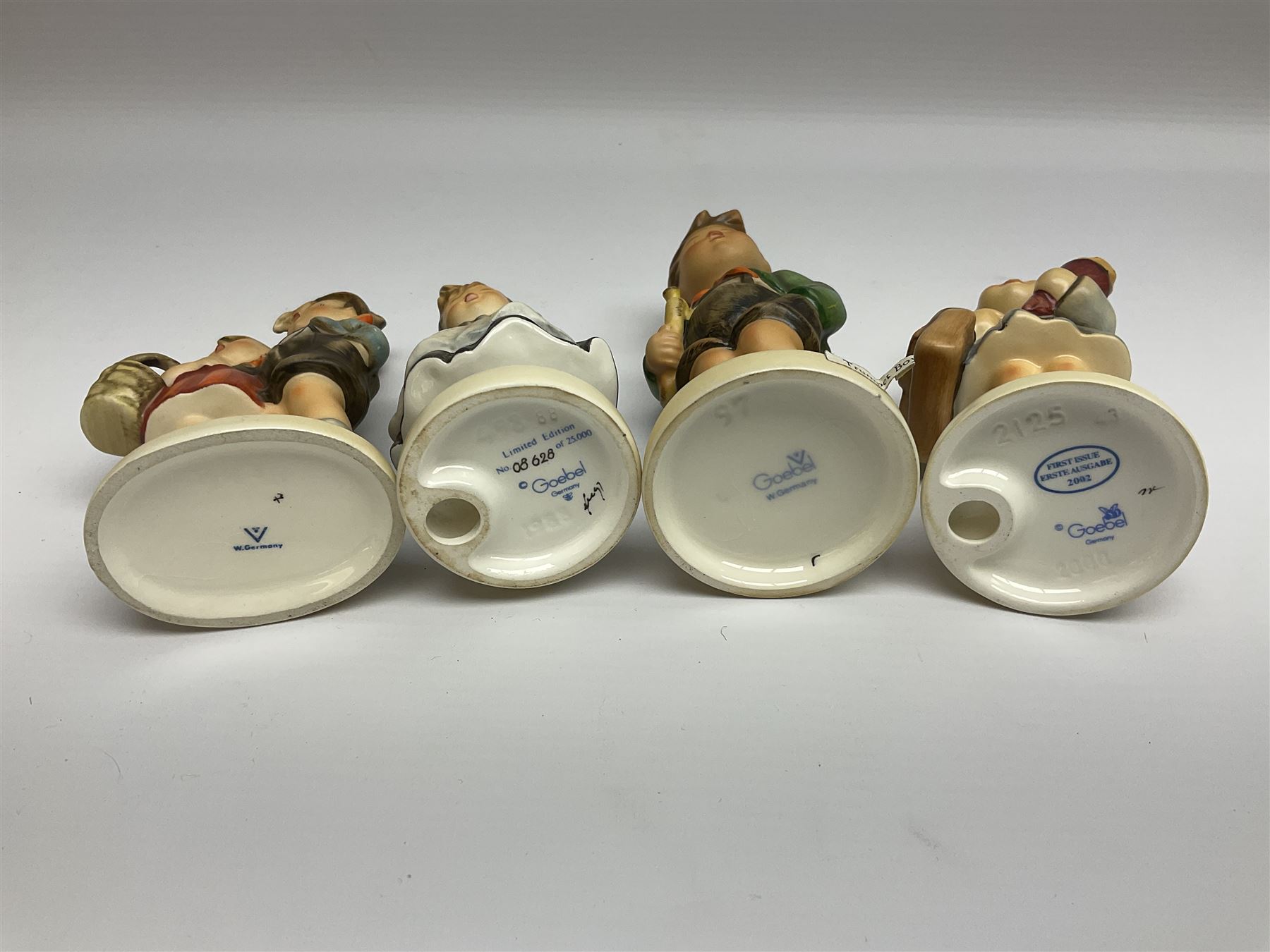 Twenty five Hummel figures by Goebel, to include Tuning up, Blessed Event, Book Worm, The Little Architect etc 