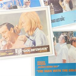  Collection of seventeen James Bond lobby cards starring Sean Connery and Roger Moore including Thunderball, You only Live Twice, Live and Let Die, From Russia with Love etc each 21cm x 27.5cm 