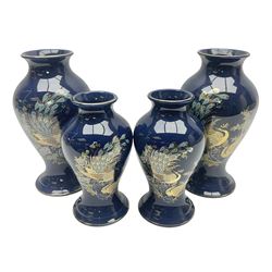 Two pairs of Royal Winton vases, decorated with peacocks on a blue ground, largest H24cm