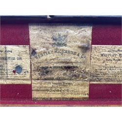 Leather shotgun case, the red baize lined interior with the trade labels of Westley Richards & Co., London, a brass plaque inscribed 'T Nevin, Mirfield, Yorkshire' to cover, with key, case to fit barrel 76cm (30 inches)  

