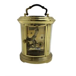 English - 20th century  8-day oval carriage clock, in a polished gilt case with an enamel dial, Roman numerals and moon hands, dial inscribed Mathew Norman, London, timepiece spring driven movement with a lever platform escapement, balance with timing screws. 