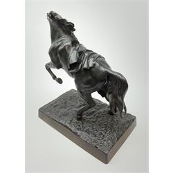 A Russian bronzed cast iron figure of a rearing horse, signed to base, overall H38cm. 