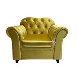 Chesterfield shaped armchair, upholstered in buttoned gold fabric, with scatter cushions
