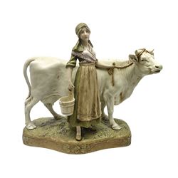 Royal Dux figure of a Milkmaid with Cow, number 988 with applied pink triangle mark to base, H28cm
