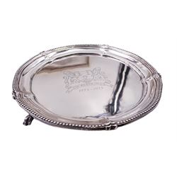 Modern silver waiter, of circular form with engraved crest to centre and dates 1773-1973 and beaded rim, upon three paw feet, hallmarked Nathan & Co, Birmingham 1973, D15.5cm, contained within a fitted presentation box, approximate silver weight 6.83 ozt (212.4 grams)