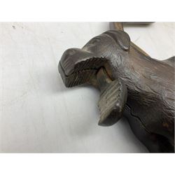 Cast metal nutcracker, in the form of a dog together with a pair of Swift Saratoga 8x40 binoculars in leather case and a hip flask, the glass flask covered in leather to the top with a detachable silver plated cup to base