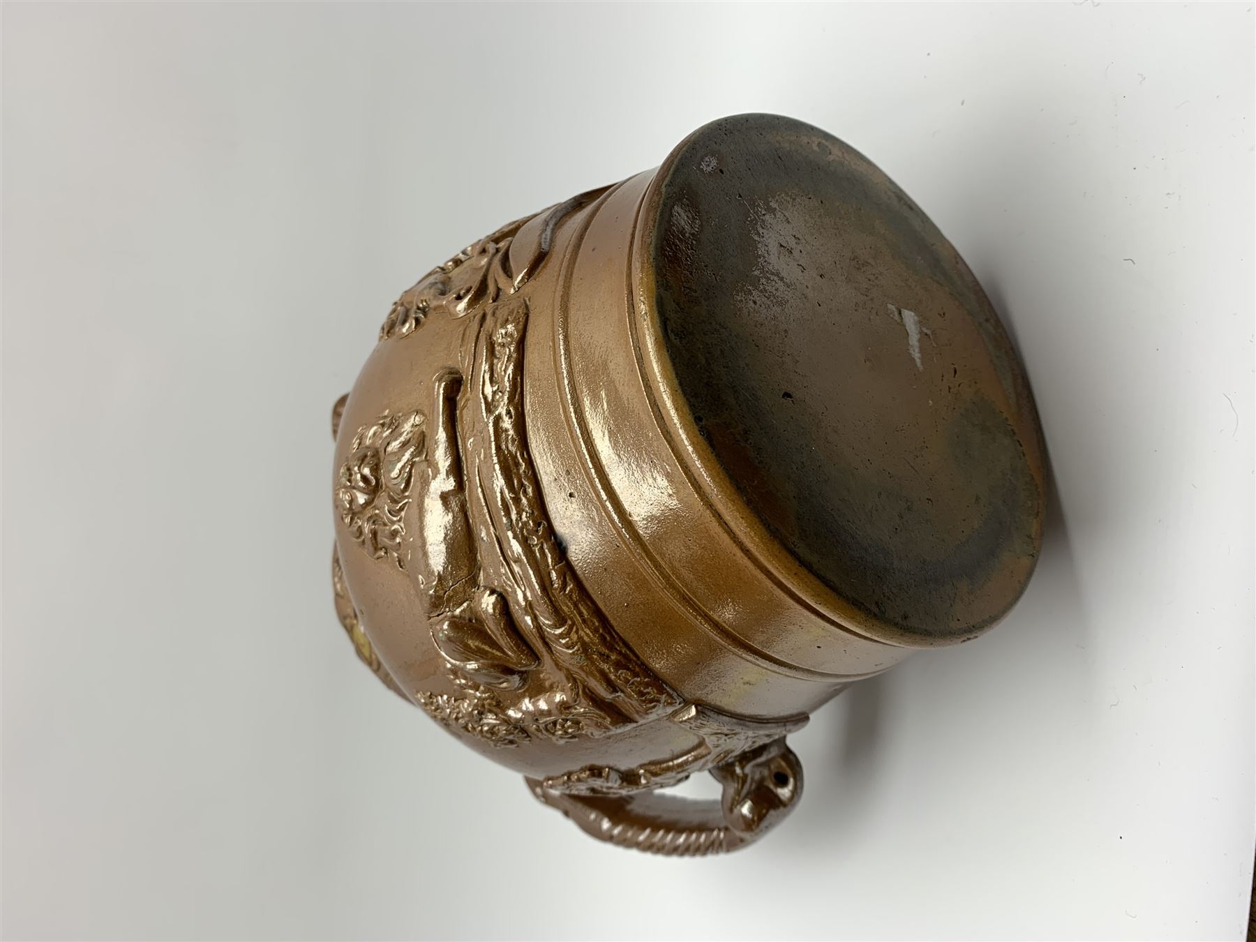 19th century salt glazed stoneware jug, with mask spout and greyhound modelled handle, the body decorated in relief with Royal Coat of Arms flanked by lions, the rim with the flowers of the union, roses, thistles and shamrocks, H26.5cm