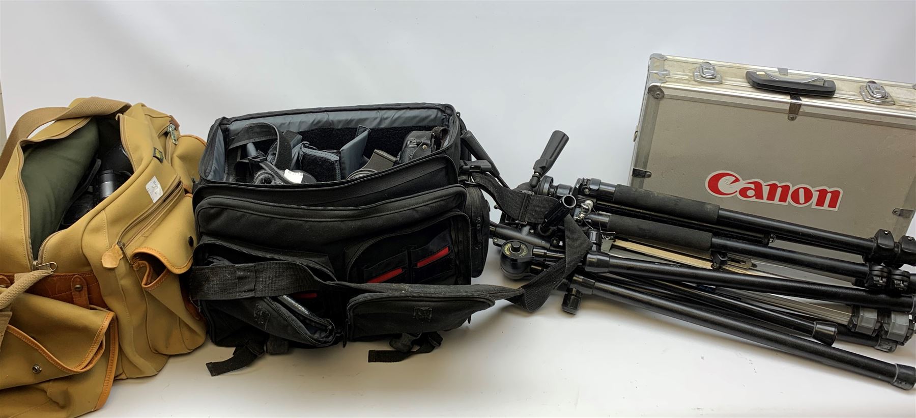 Canon EOS-1 camera body, Canon EOS-1N camera body, Tamron and Sigma camera lenses, two tripods, camera bags and various other accessories 