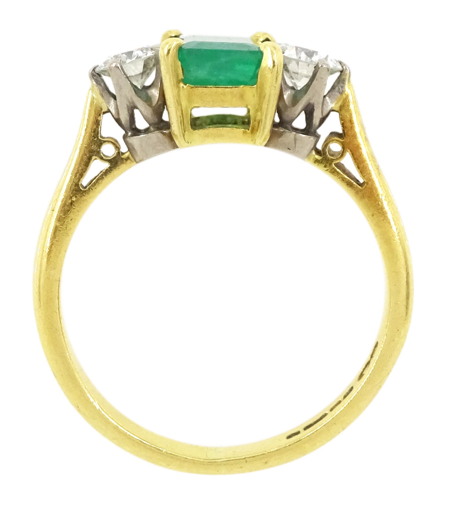 18ct gold three stone octagonal cut emerald and round brilliant cut diamond ring, Sheffield 1981, emerald approx 0.80 carat, total diamond weight approx 0.35 carat