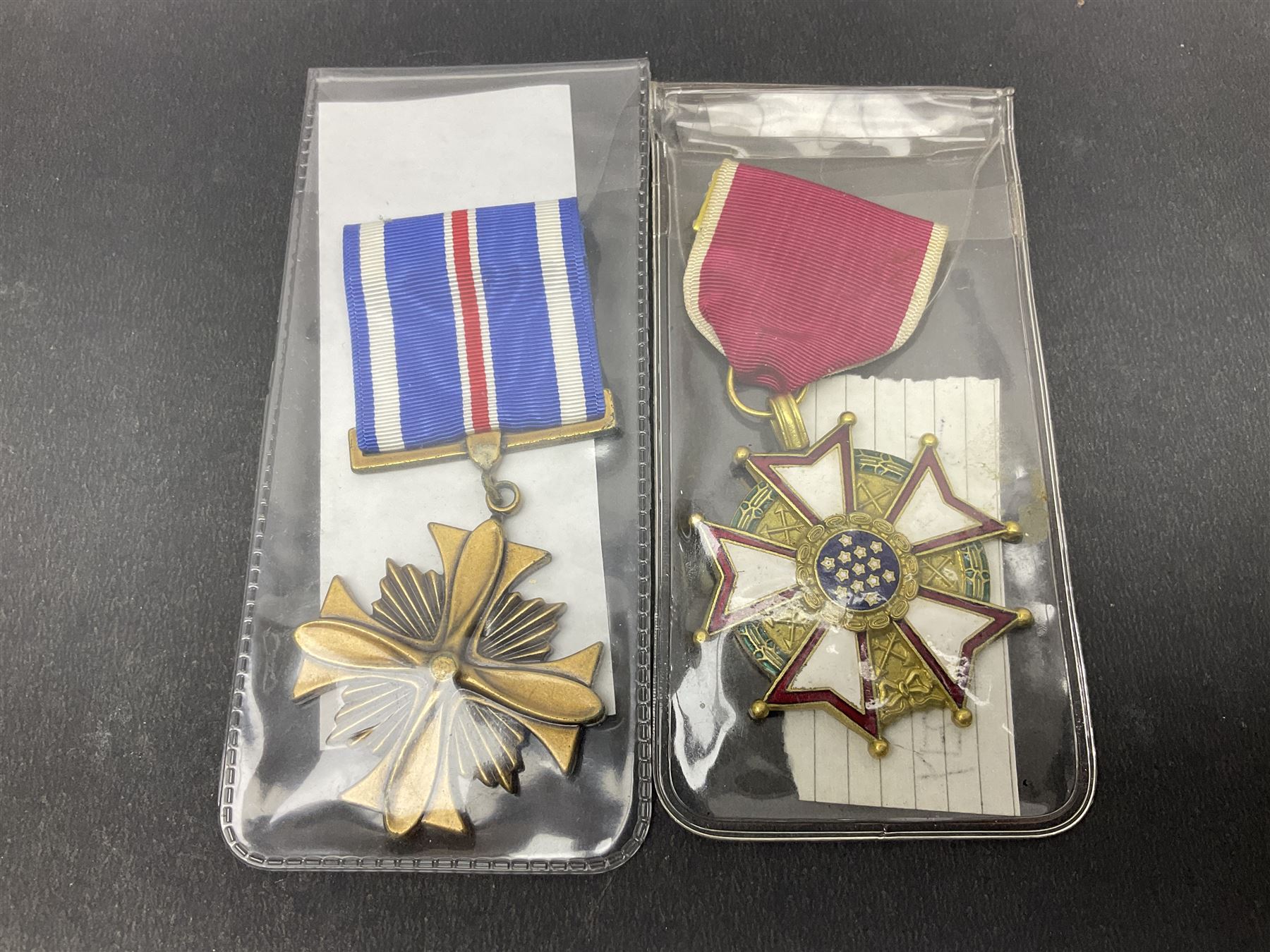Nine American medals comprising Legion of Merit, Distinguished Flying Cross, Purple Heart named to Dick L. Sparman, Navy Good Conduct Medal, National Defence Service Medal, Army Commendation Medal, two WWII Victory Medals and China Medal; all with ribbons (9)