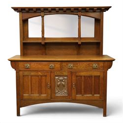 Art Nouveau oak mirrored sideboard, in the manner of Liberty's London, the raised back fit...