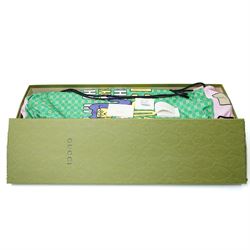 Gucci x Palace skateboard, Spring/Summer 2021, green GG monogram wood deck with multicolour ‘AH AH AH! GUCCI’ lettering and cartoon character mascot motif, fitted with Gucci-branded metal trucks and red and cream wheels, model no. 689103 JCGMN, presented with original GG monogram drawstring dust bag, protective sleeve, outer box and accompanying cards, Skateboard L81cm W20cm