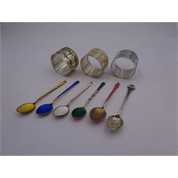 Set of three modern silver and enamel napkin rings, with 'ribbon' decoration in blue, green, and yellow, hallmarked Carr's of Sheffield Ltd, Sheffield 2013, together with a set of four 20th century silver gilt and enamel coffee spoons, marked Denmark Sterling 925, a Norwegian silver coffee spoon with enamel foliate terminal, hallmarked Birmingham 1901, also marked with F import mark, and makers mark for David-Andersen, and a 1920's silver gilt and enamel coffee spoon, hallmarked London import 1901