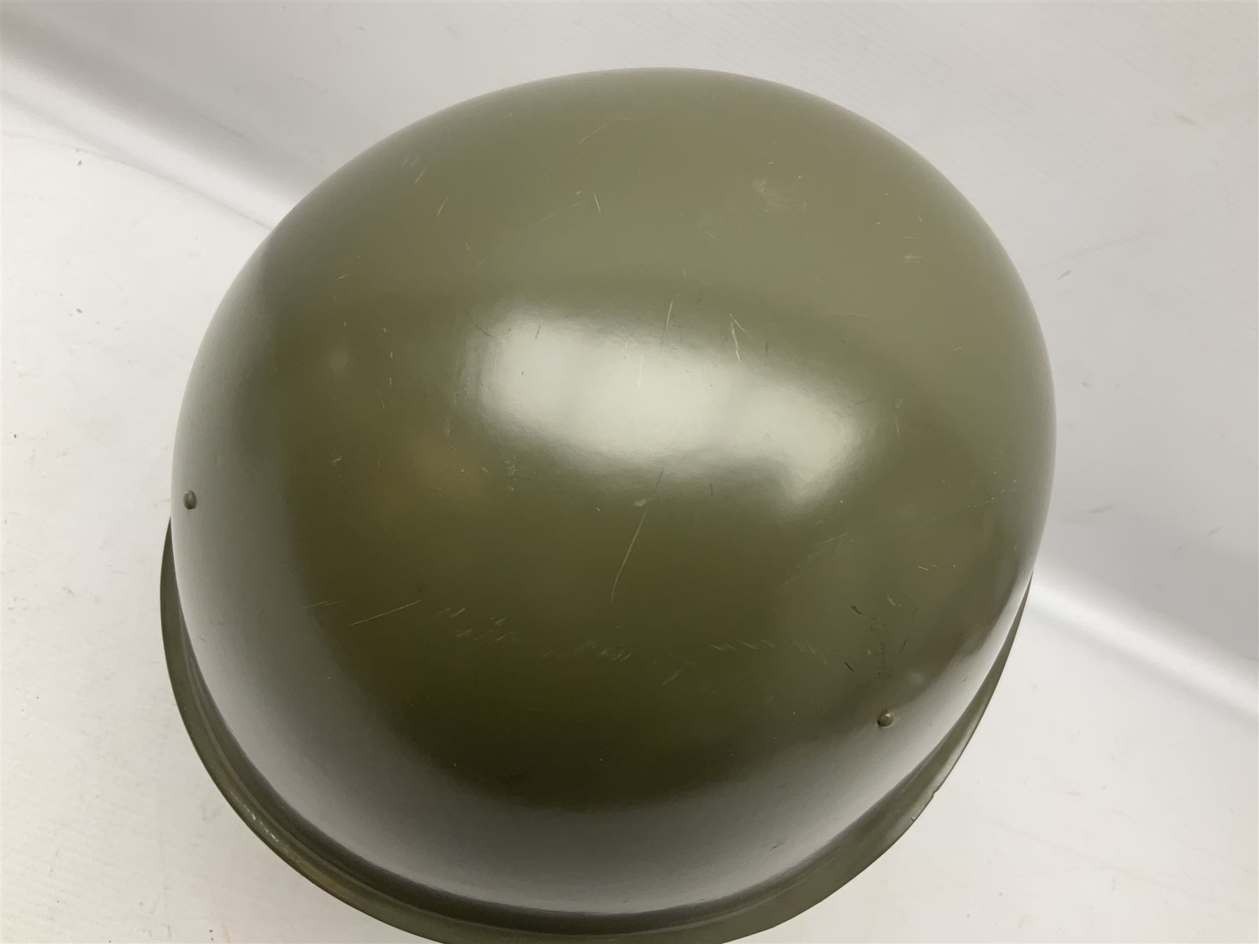 Two 1960s East Block Soviet style helmets - Czechoslovakian and Russian; both with liners (2)