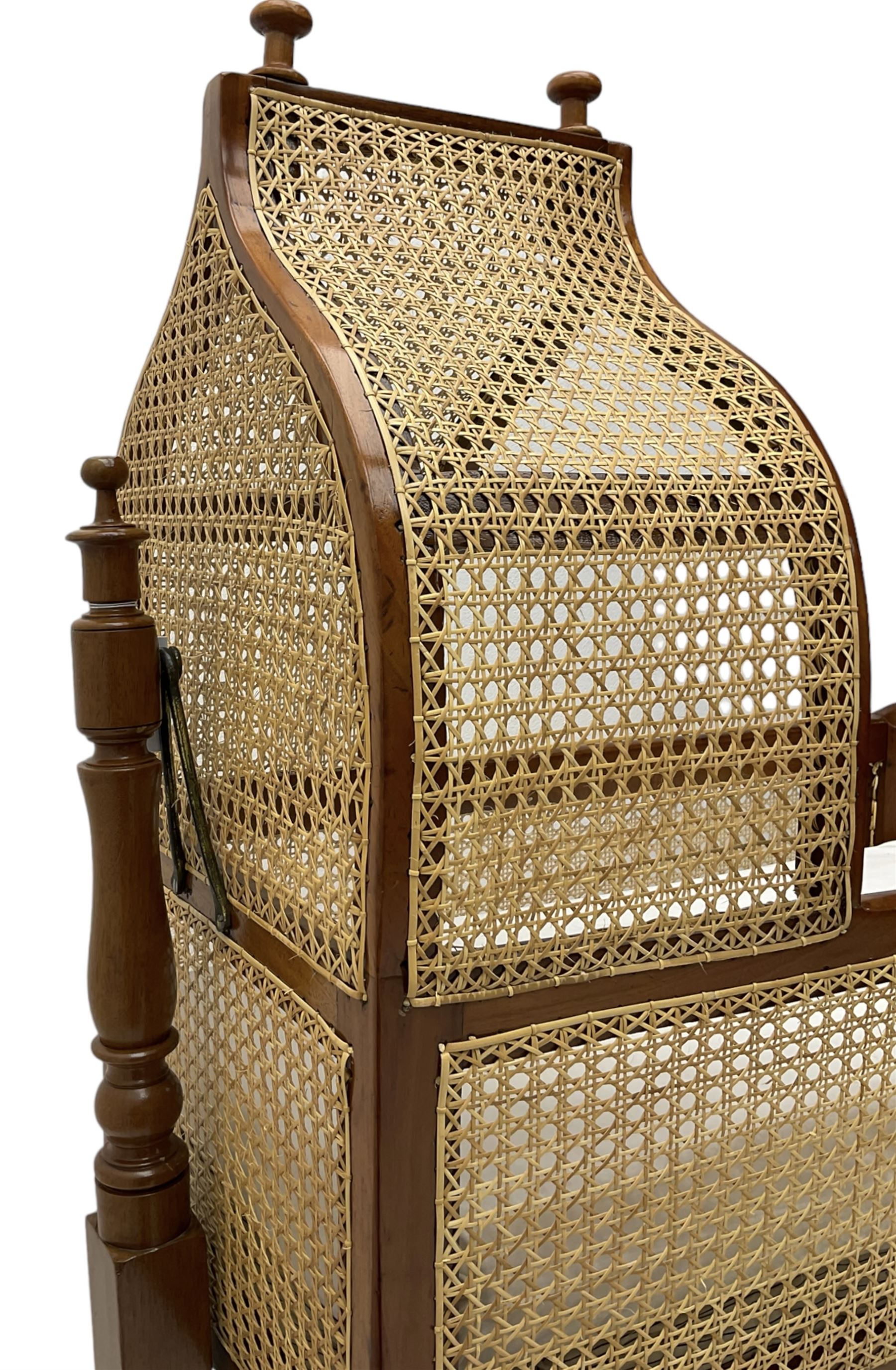 Victorian mahogany rocking crib, canework canape hood and sides